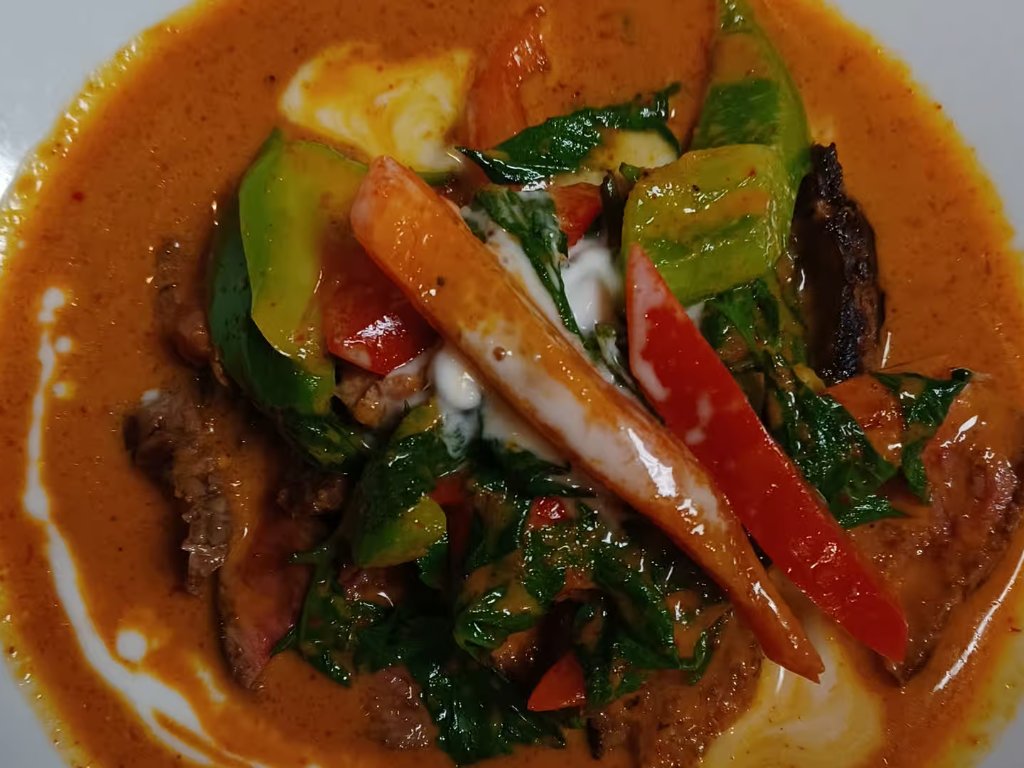 Panang Neua Yang halal grilled beef over award-winning Panang curry at Hanuman Thai Cafe Kirkland